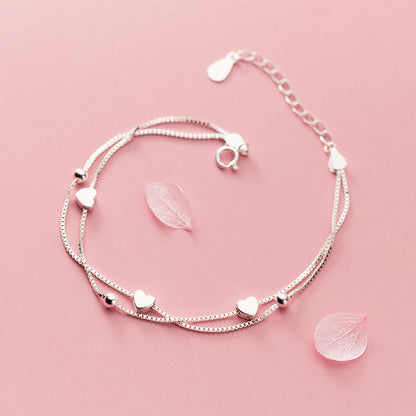 Bracelet à breloques petites boules coeurs d'amour