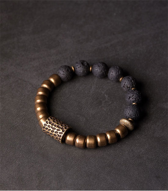 Bracelet breloque en cuivre et pierre de lave de roche