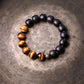 Goldenes Tigerauge-Armband aus schwarzen Obsidianperlen
