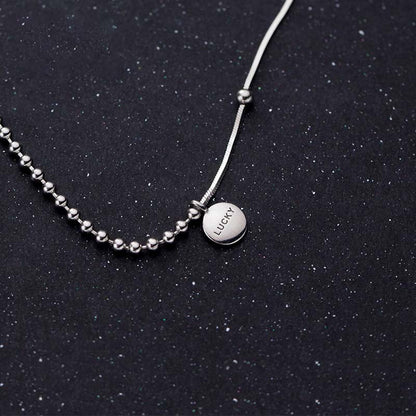 Collier pendentif petite boule porte-bonheur