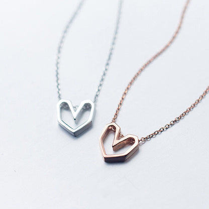 Collier ras du cou coeur géométrique en or rose