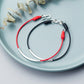 silver-elbow-red-black-rope-couple-bracelet.jpg
