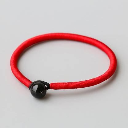 red-string-bracelet-with-black-obsidian-bead.jpg