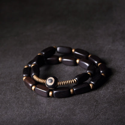 Mehrschichtiges Armband aus schwarzen Holz- und Kupferperlen