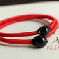red-string-bracelet-with-black-obsidian-bead.jpg