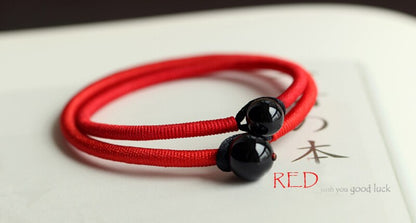 red-string-bracelet-with-black-obsidian-bead.jpg