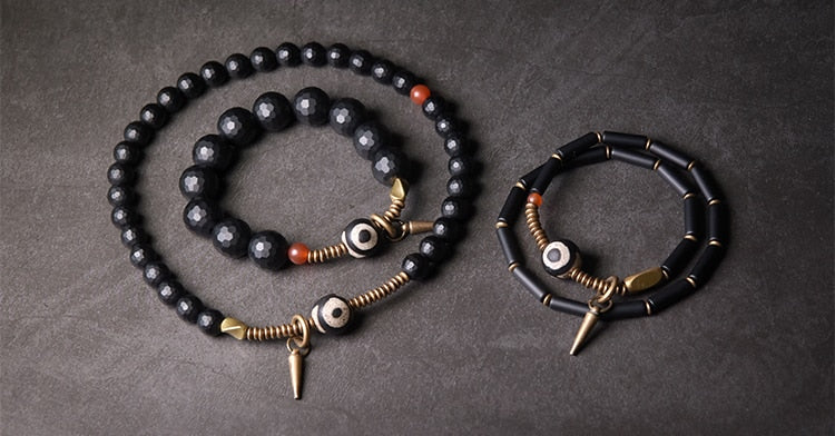 Faceted Onyx Beads Bracelet with Tibetan Anti Evil Bead