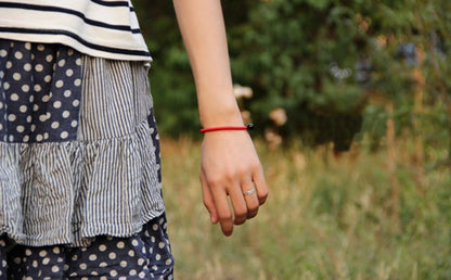 red-string-bracelet-with-black-obsidian-bead.jpg