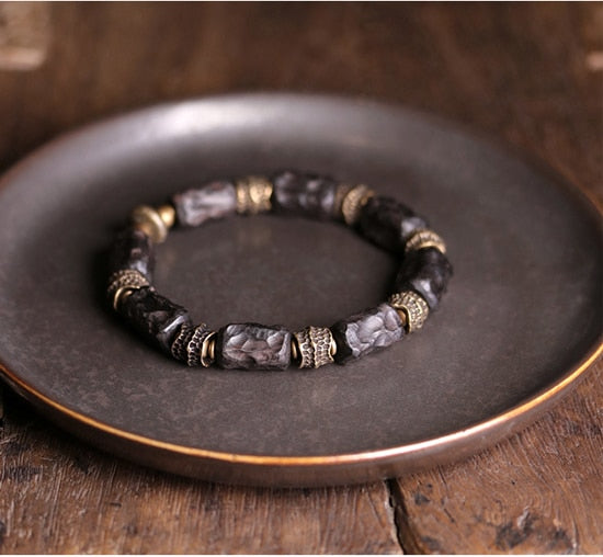 Bracelet made of Concave Convex Ebony Wood Bead and Hammered Copper