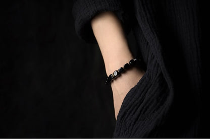 Bracelet en pierre d'obsidienne noire cubique avec breloque en laiton