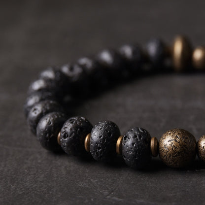 Bracelet de perles de lave noire et de cuivre oxydé