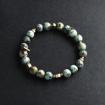 Bracelet à breloques en perles de pierre naturelle et en cuivre