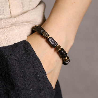 Bracelet made of Concave Convex Ebony Wood Bead and Hammered Copper