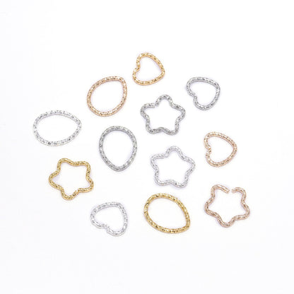 Anneaux de saut torsadés Gold Star 16,5 mm, 50 pièces