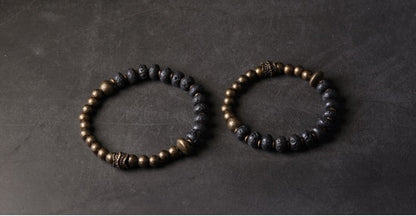 Bracelet de perles de lave noire et de cuivre oxydé